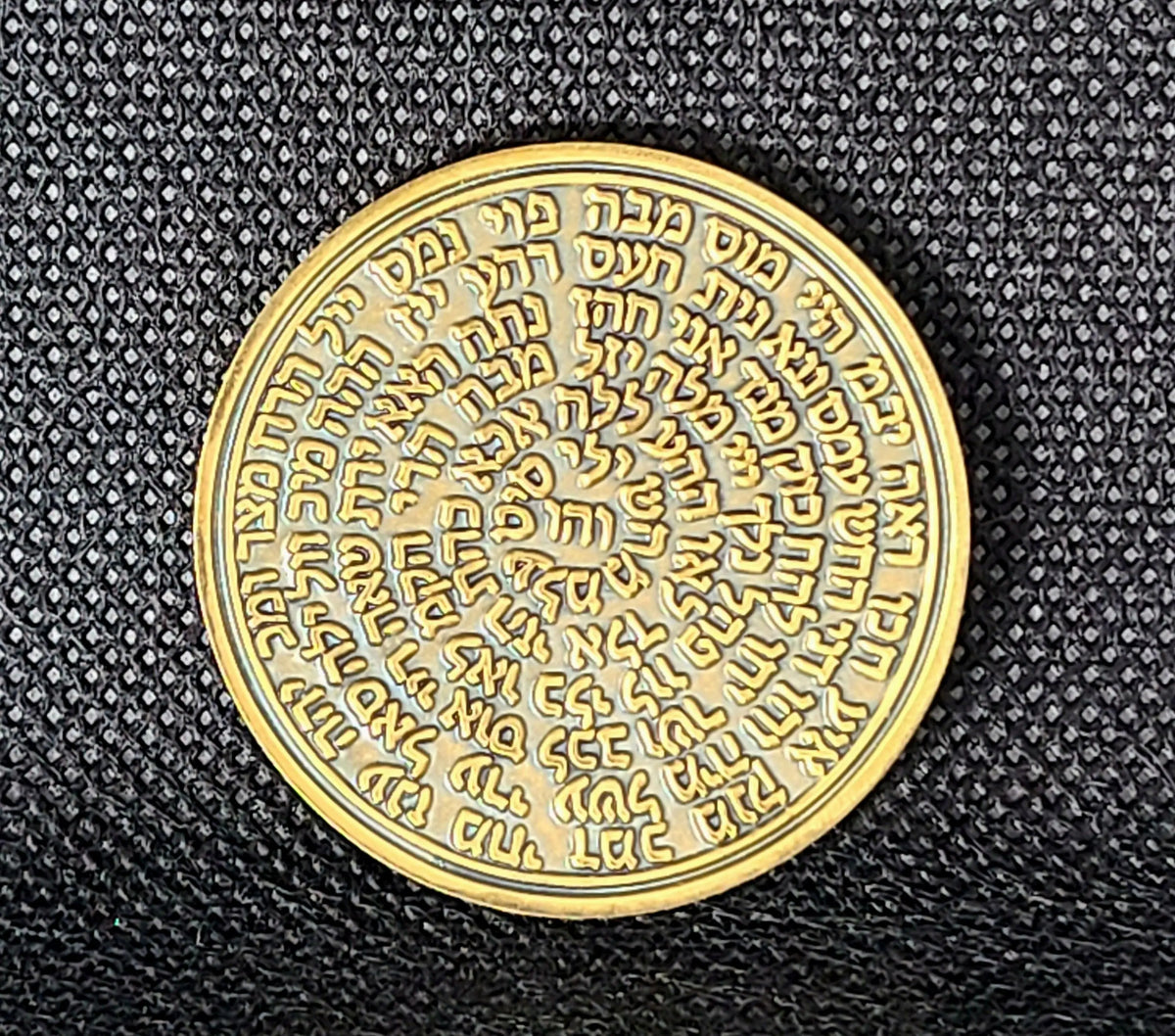 Archangel Jophiel solid brass coin displayed on parchment with Solomonic geometry
