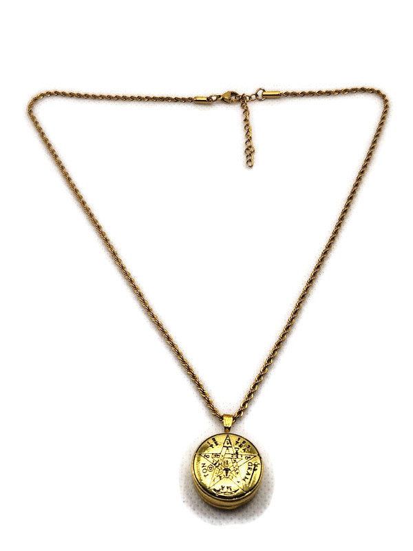 Gold necklace with a round pendant on a white background